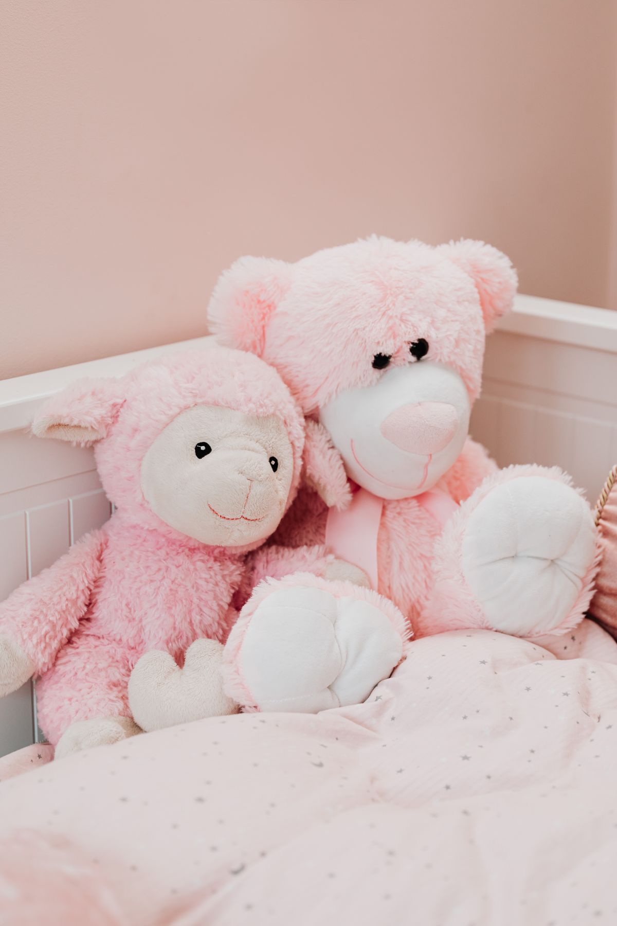 Two fluffy pink plush toys